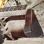 Heavy duty wheel loader working on mining site.